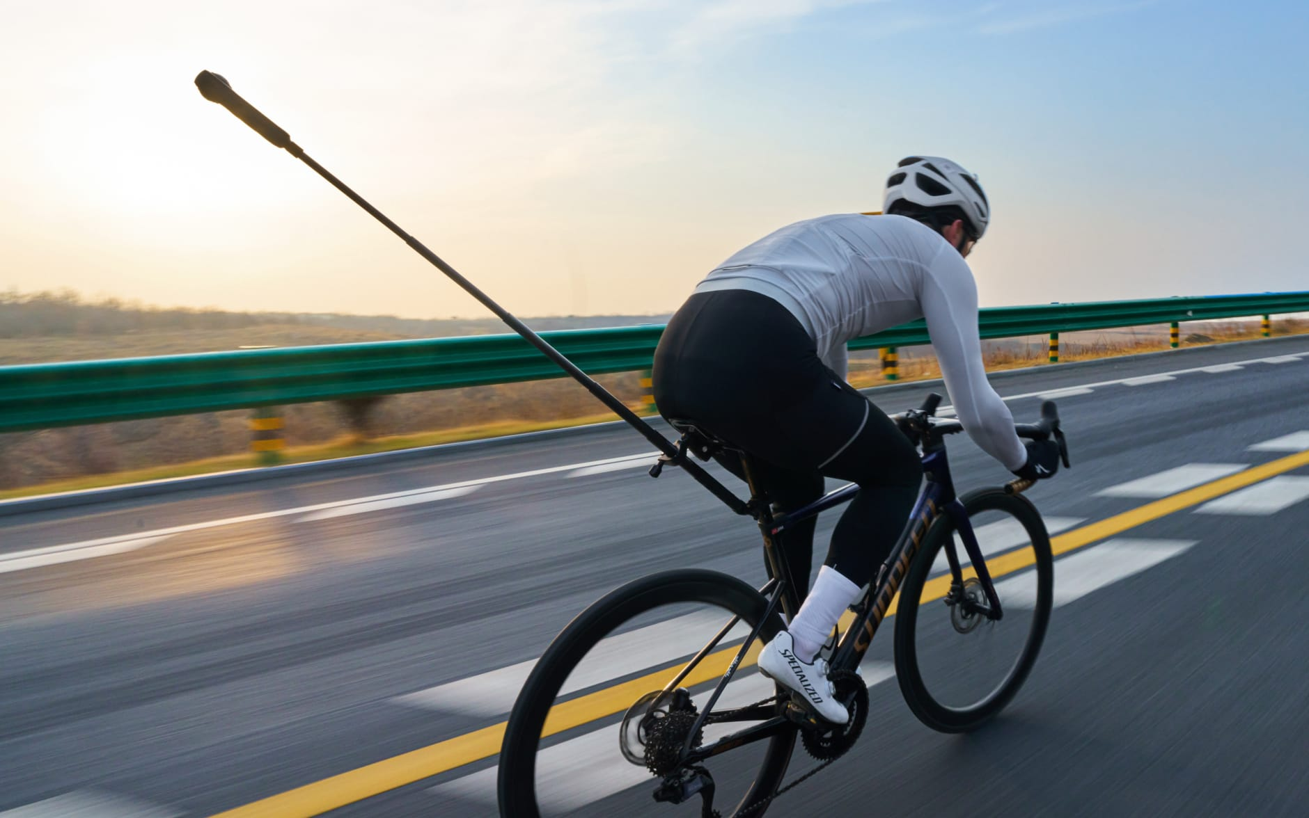 Insta360 X5 invisible selfie stick effect showing a cyclist from behind